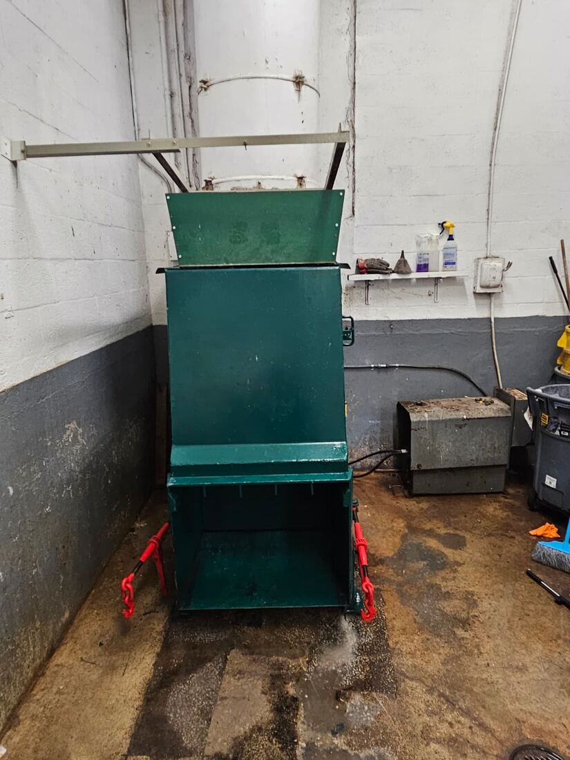 Waste compactor installed indoors